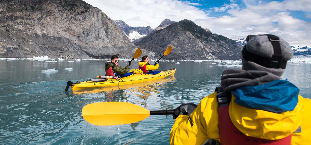 A group kayaking in Alaska. View 7-day Inside Passage cruise now.