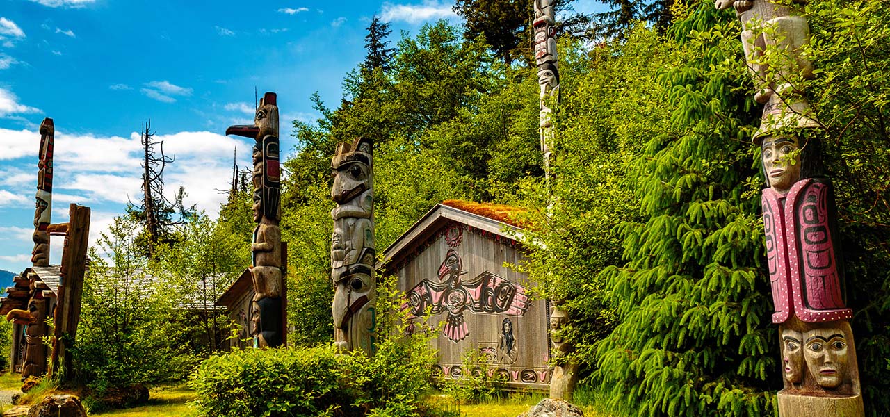 Totem pole carvings in Alaska. View 10-day Inside Passage cruise now.