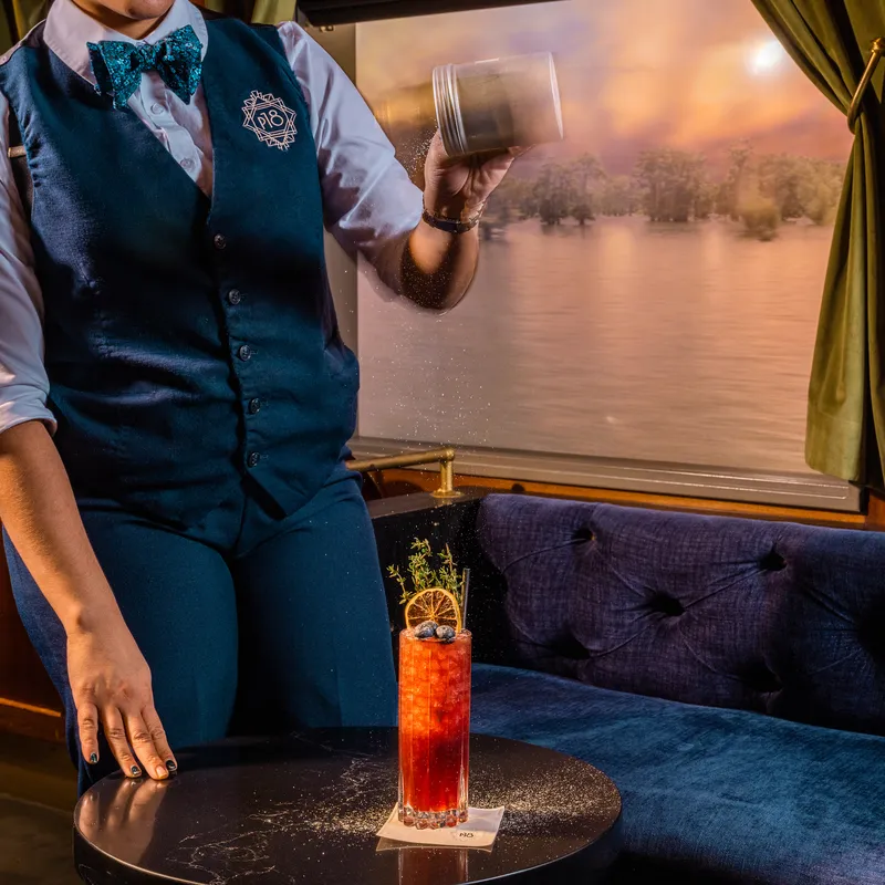 The Desiré Street Market cocktail being sprinkled with caraway powder at Platform 18 in Phoenix Arizona.