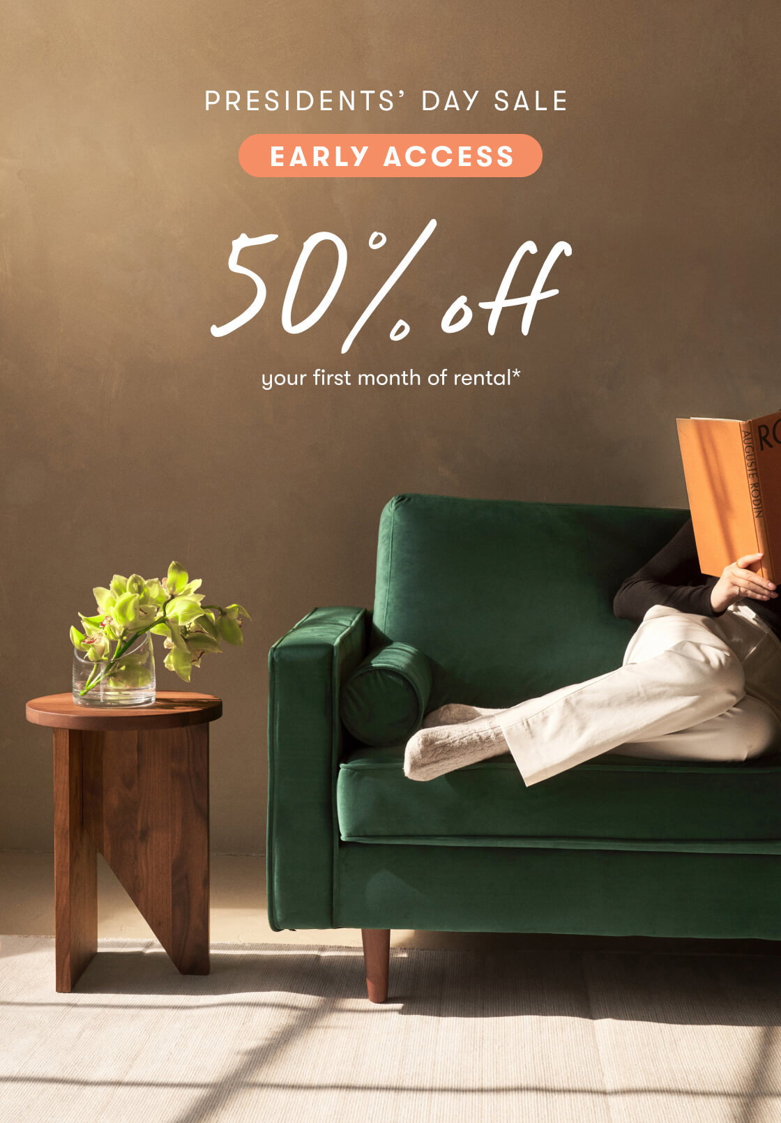 Image of woman sitting on the Monroe sofa reading a book, also featuring the Homer side table with a plant on top. Also featuring ''Presidents' Day Sale - Early Access, 50% off your first month of rental'' 