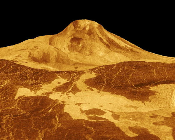View of an otherworldly landscape, held entirely in sepia tones. On the horizon, a domed volcanic peak stands out starkly against a black sky.