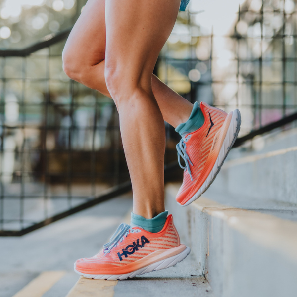Woman wearing a pair of HOKA Mach 5 shoes