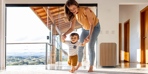 a women with her kid in a room image