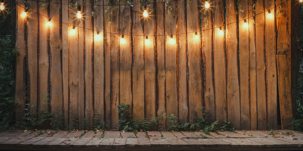 photo of a backyard patio with lights and decorations