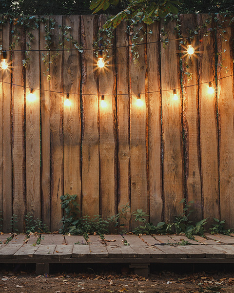 photo of a backyard patio with lights and decorations