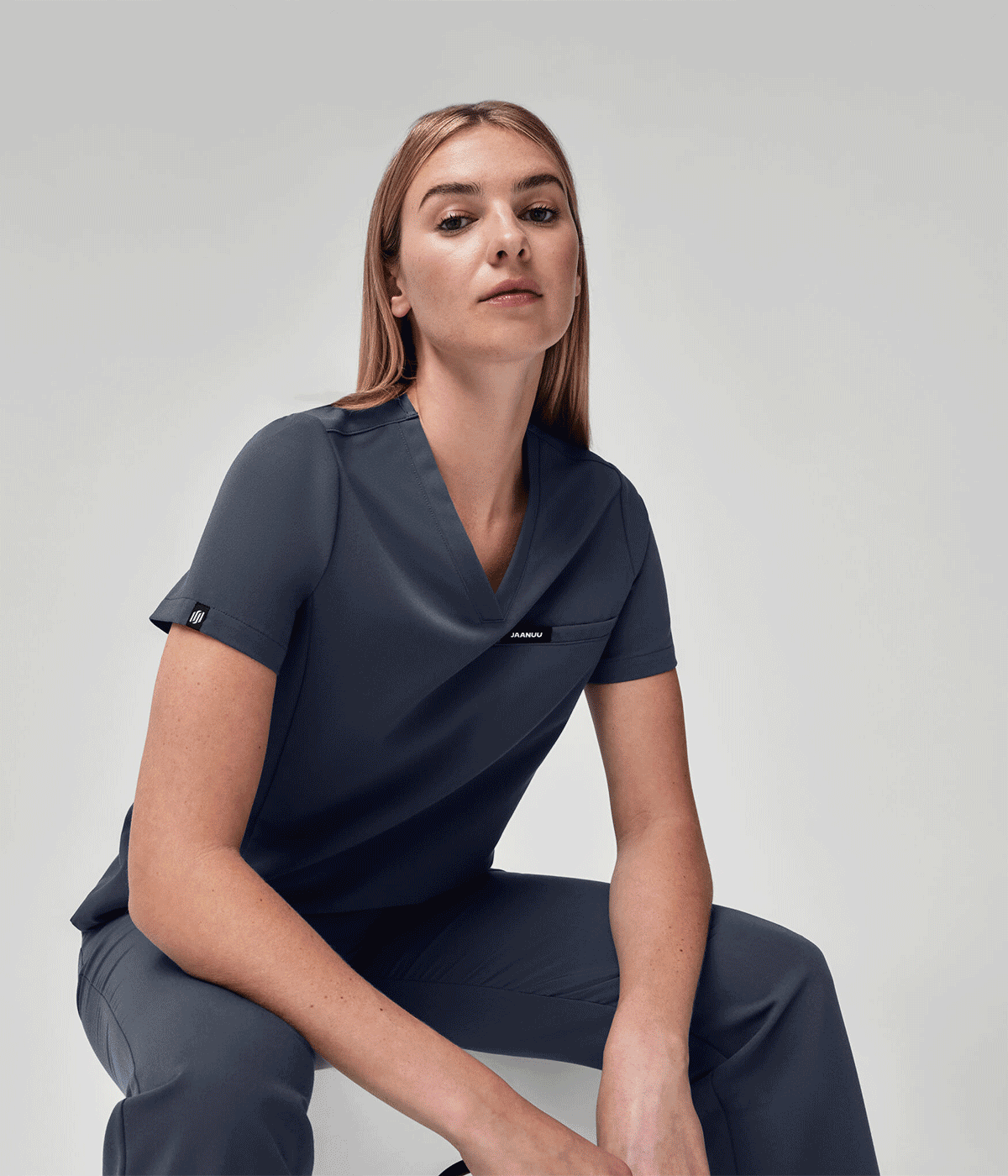 Gif of women wearing different Jaanuu scrub sets in various colors and styles