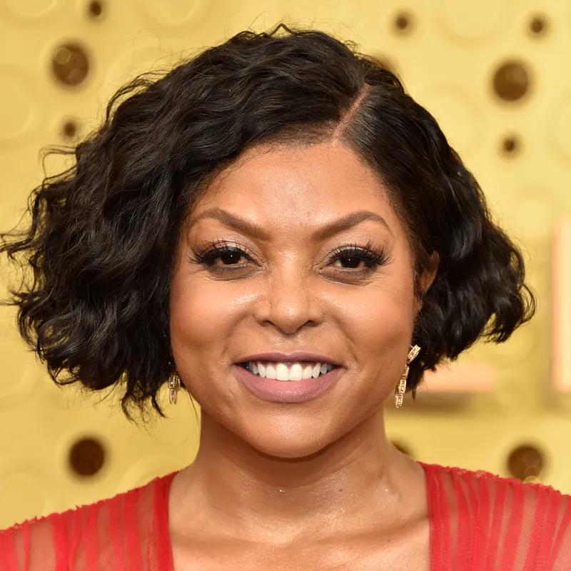 headshot of taraji p henson smiling with a wavy bob 