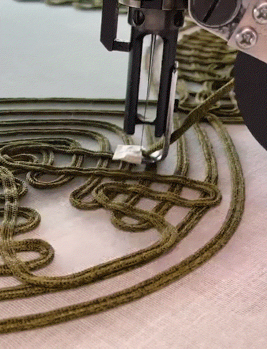 GIF of speciality machine embroidering the olive Embroidered Viscose Knit Dress