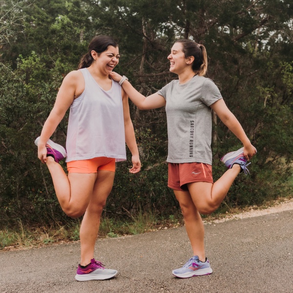 Two women wearing Saucony shoes