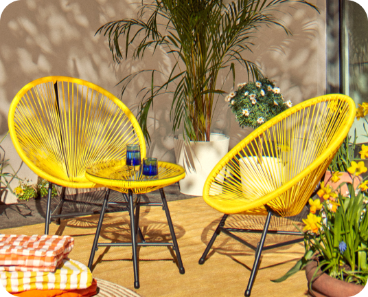 Two yellow chairs surrounded by plants linking to backyard brights edit page