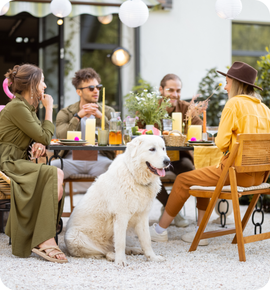 A group of people and a dog sitting at a table linking to sales and events page