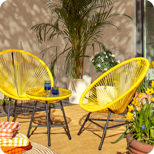 Two yellow chairs surrounded by plants linking to backyard brights edit page