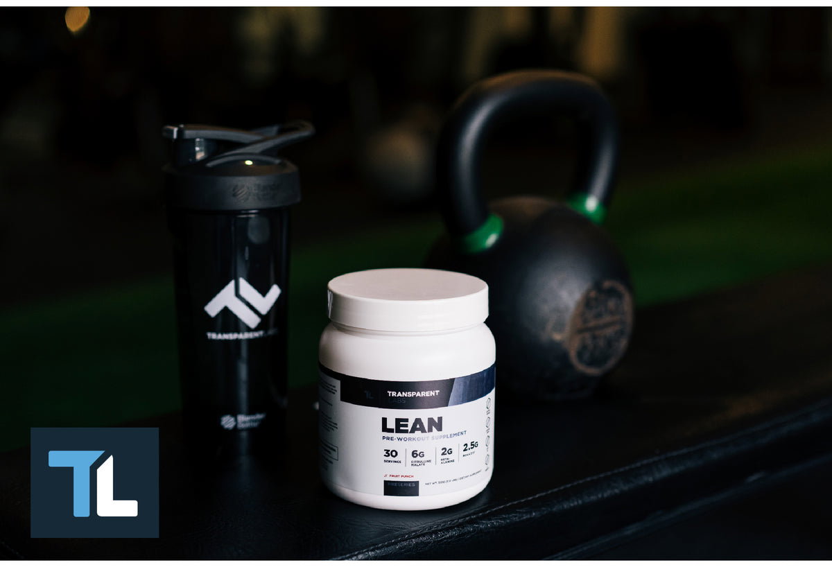 Lean sitting on a bench next to a shaker and kettlebell