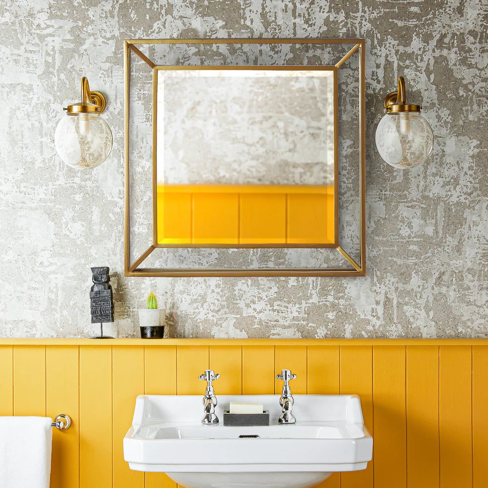 grenada mirror in an antiqued brass finish