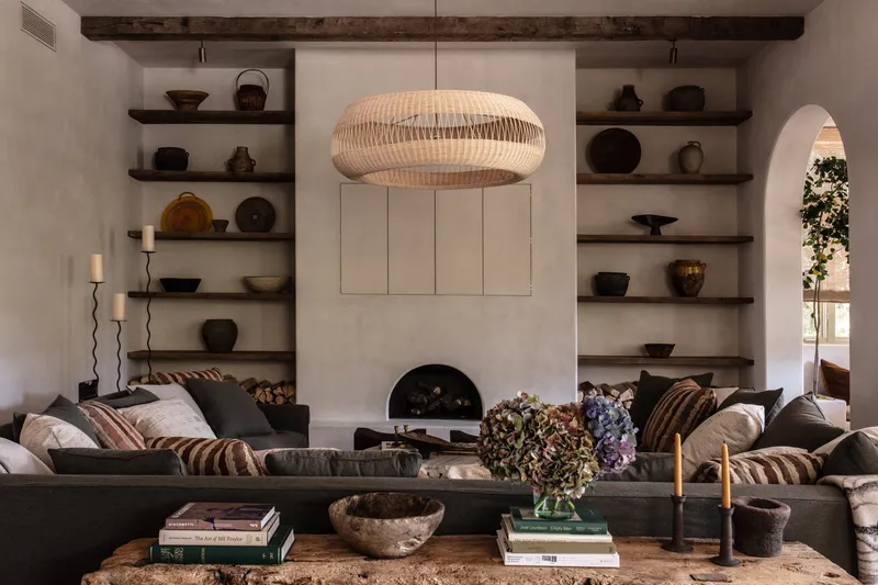 Living Room, Room, Indoors, Furniture, Interior Design, Fireplace, Hearth, Shelf, and Table