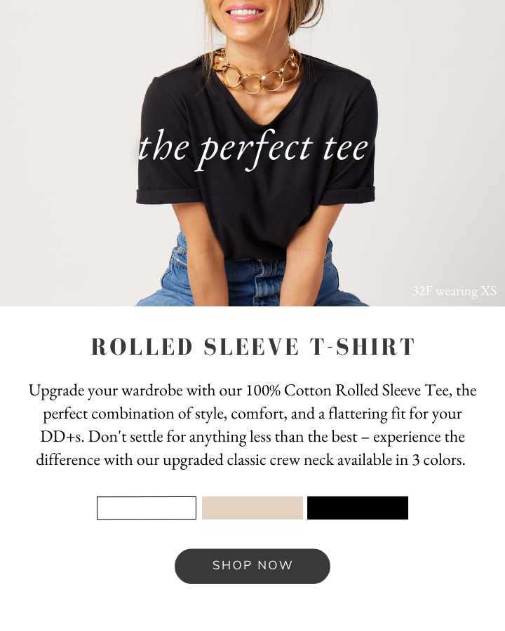 Woman wearing a black tshirt and blue jeans with a rosegold statement necklace