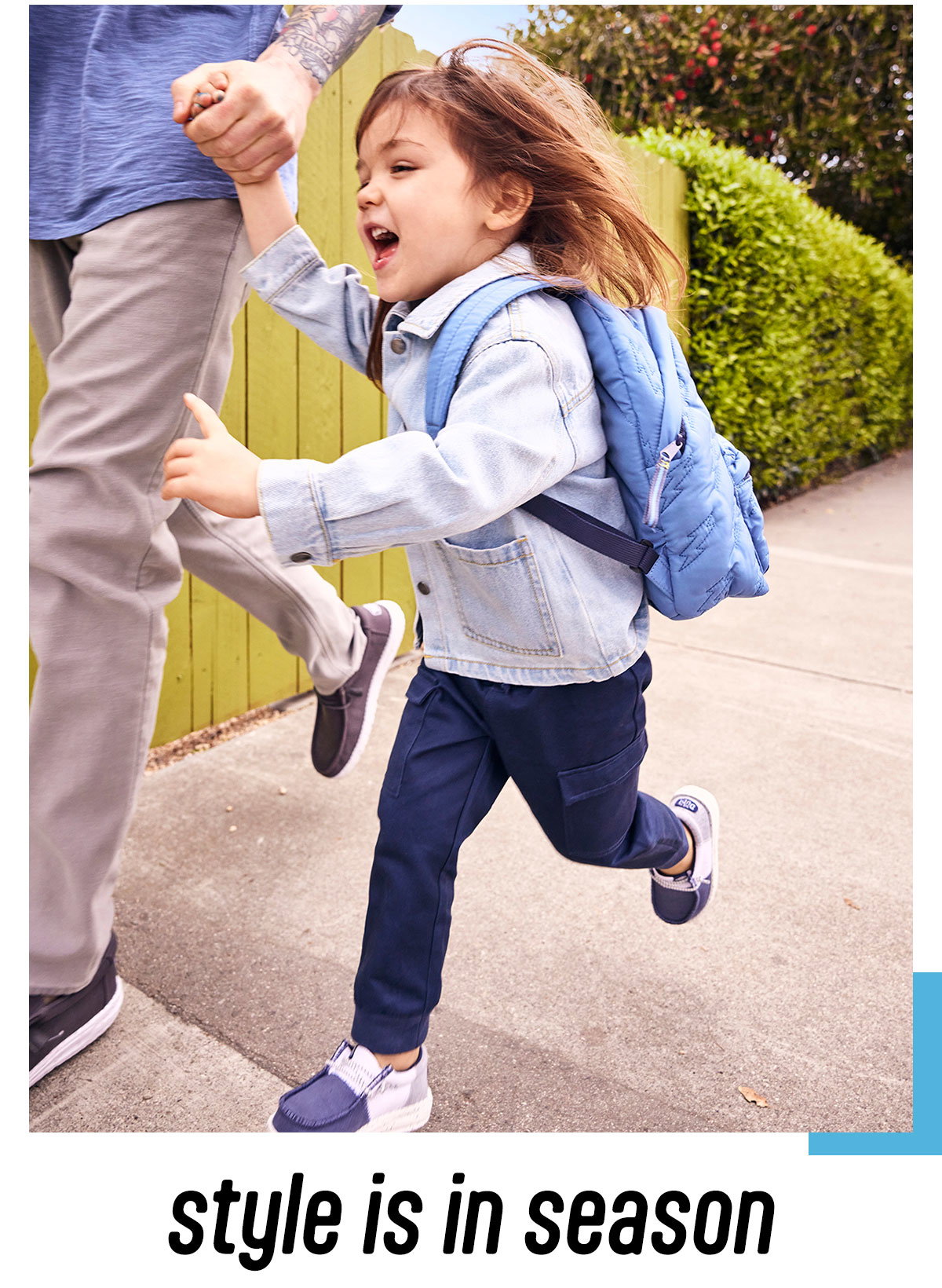 Kid running in HEYDUDE shoes.