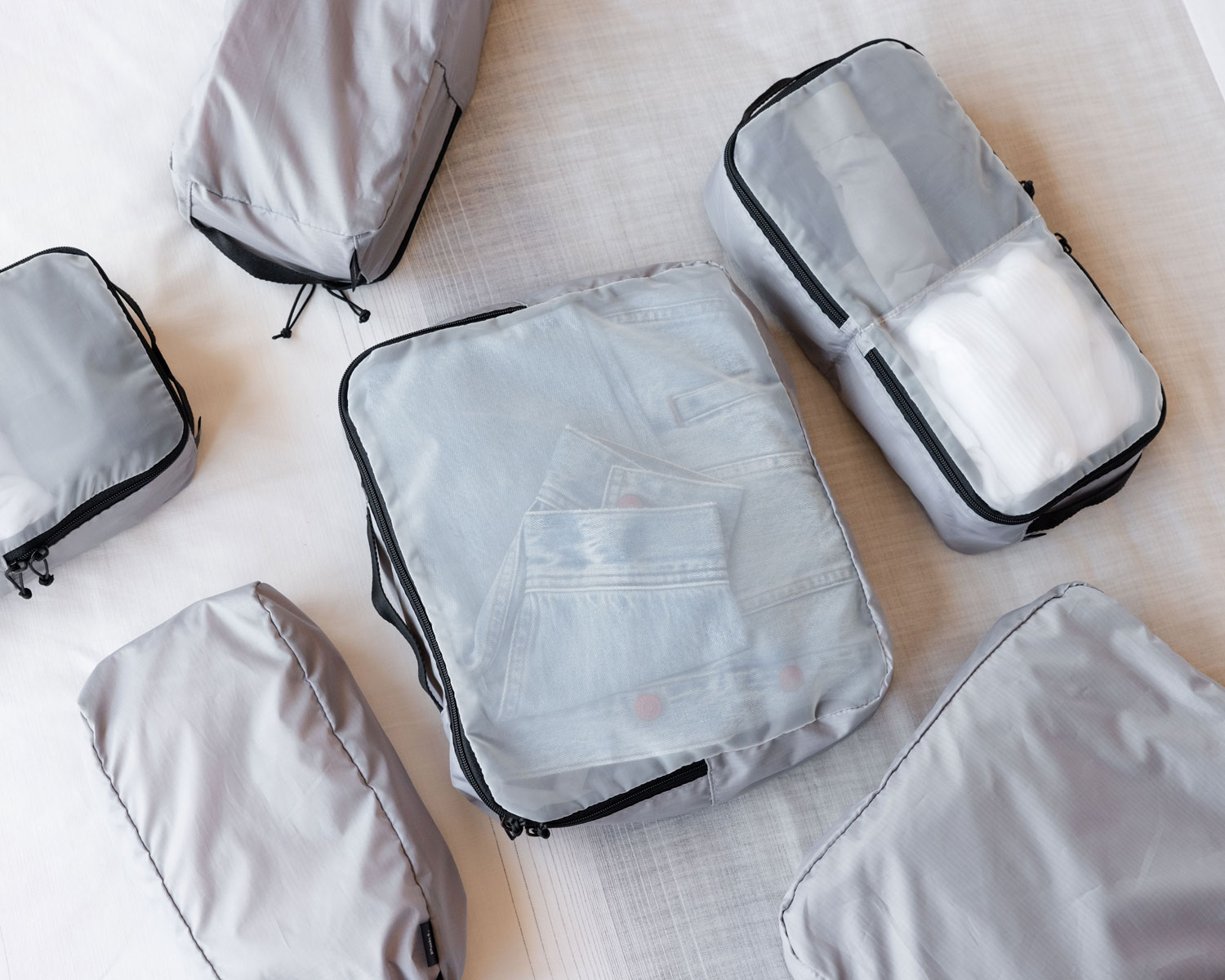 6-piece packing cube set with translucent view-mesh panels