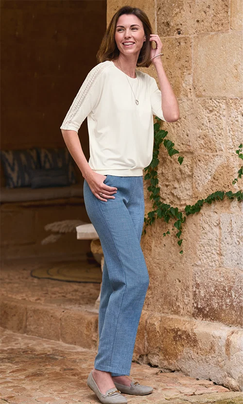 Loose-fit, blouson-style top with intricate lace detailing