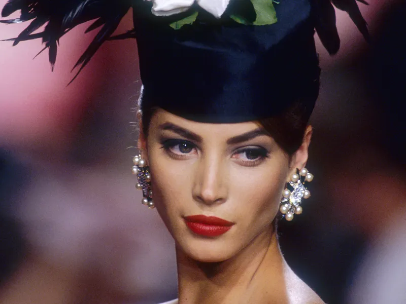 Image may contain: Human, Person, Christy Turlington, Clothing, Apparel, Face, Plant, Flower, and Blossom