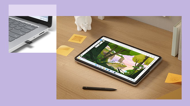 New Surface Laptop Studio 2 lays flat on desk next to Surface pen. Image of illustration on its screen.