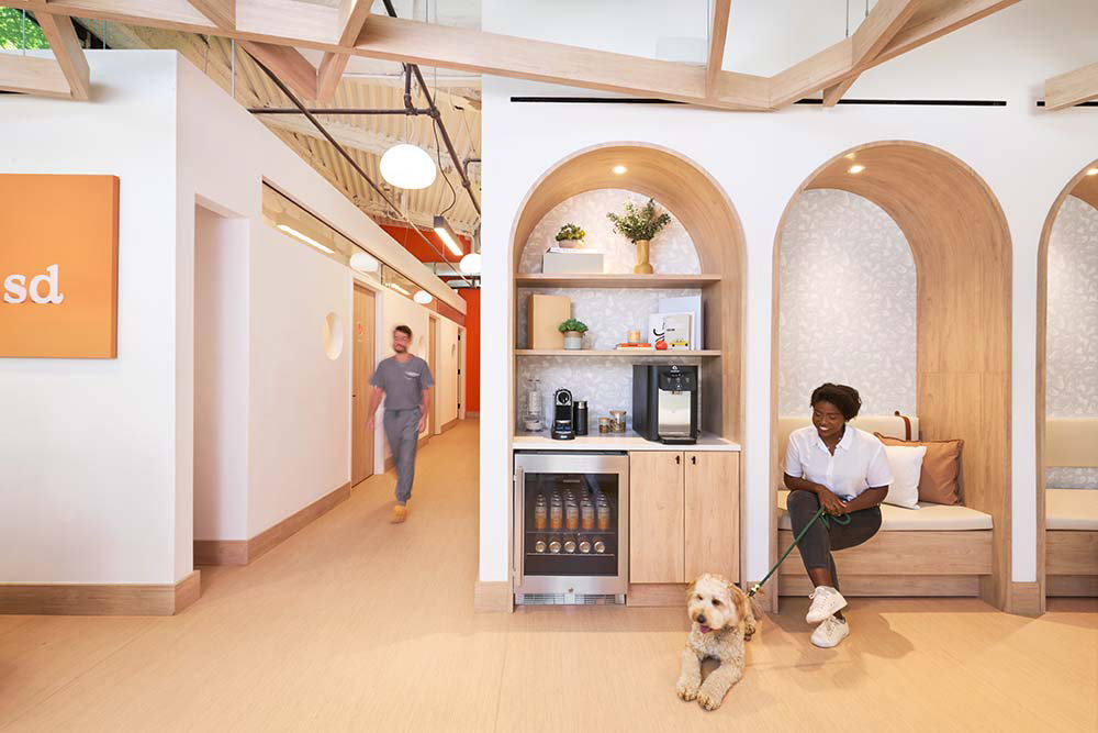Woman and dog in Small Door waiting area