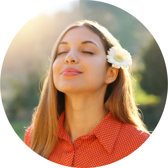 Woman with face to the sun