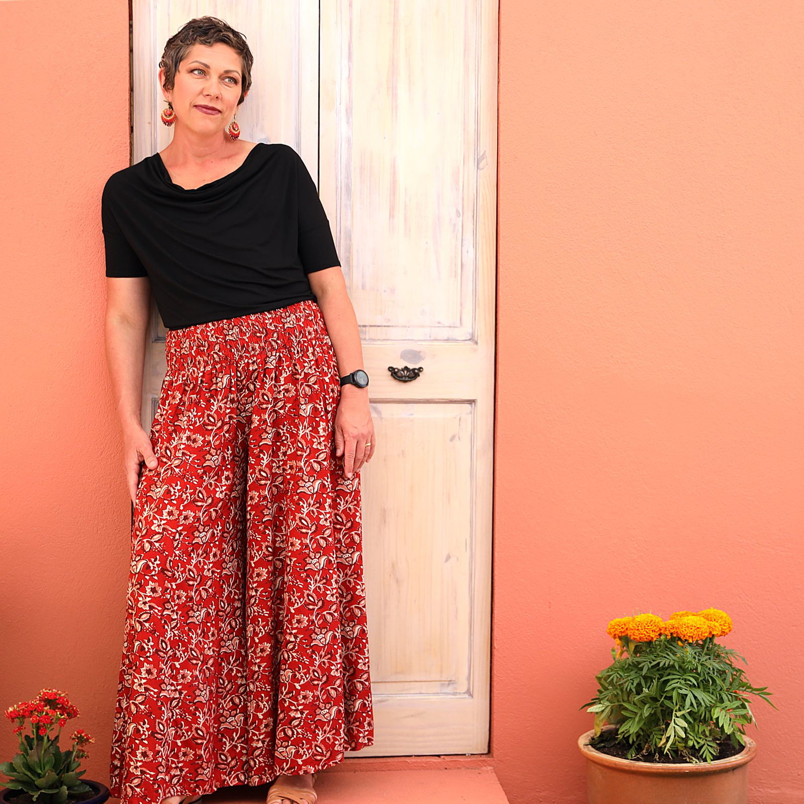 Picture of woman in red pants and black top