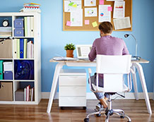 Photo of a person sitting at a desk studying.