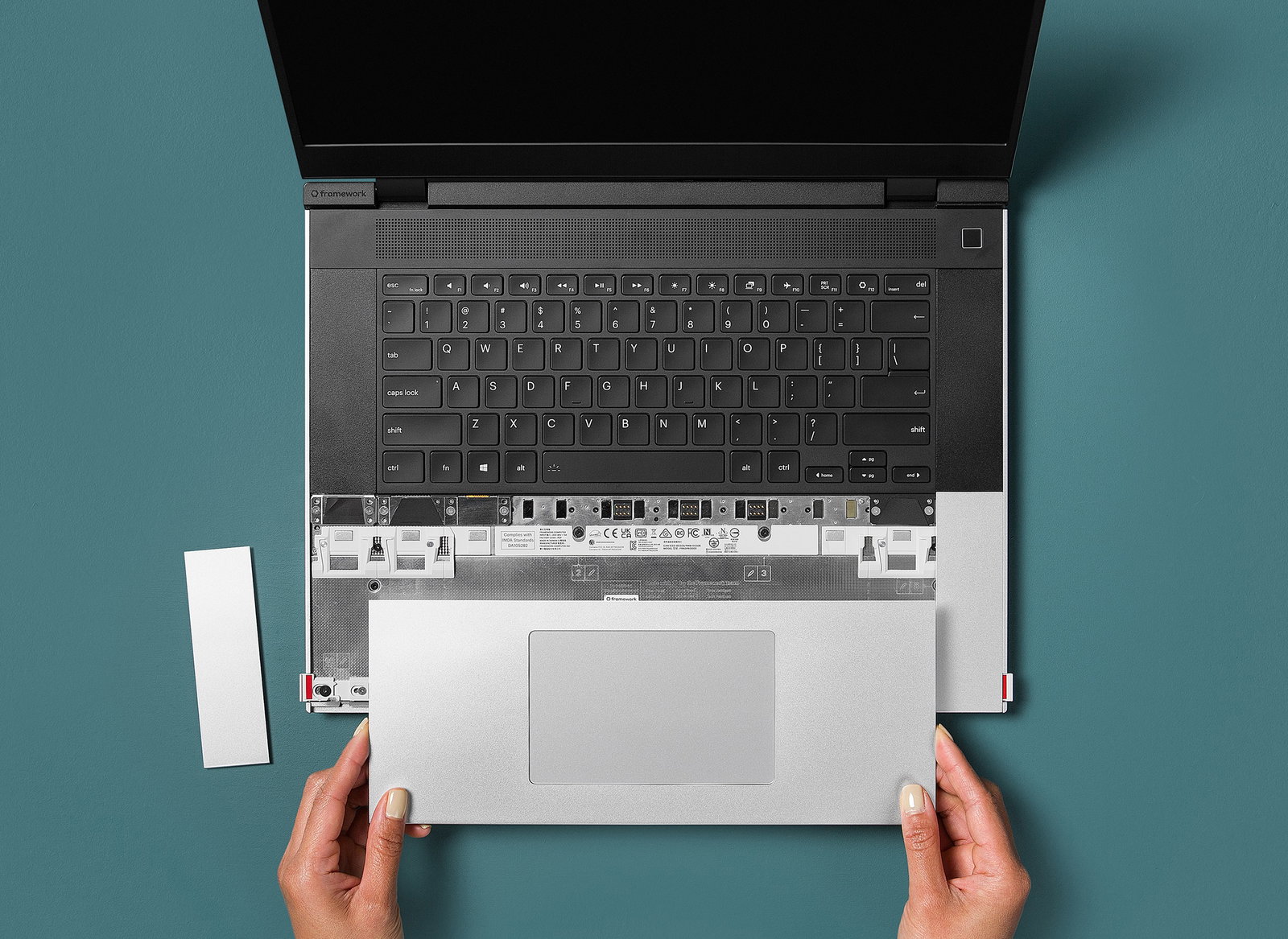 Holding a Framework Laptop 16 touchpad