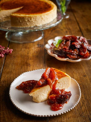 A slice of baked cheesecake with fig compote 