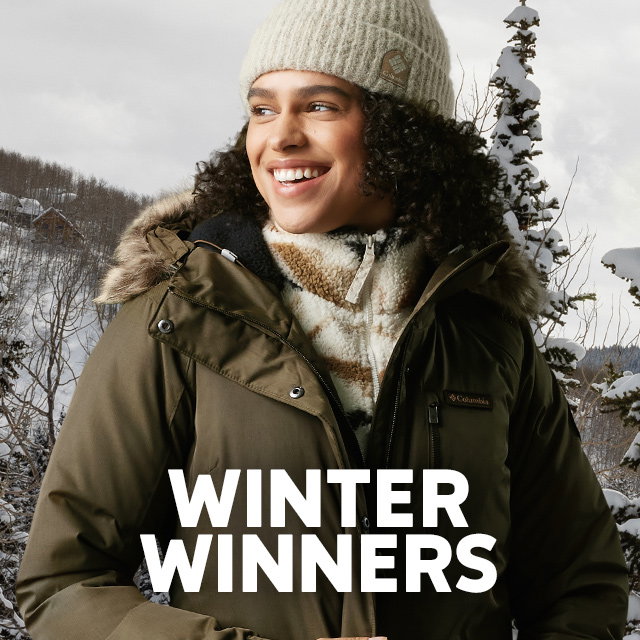 A woman looking cozy in her top-rated winter insulated jacket. Headline: Winter Winners.