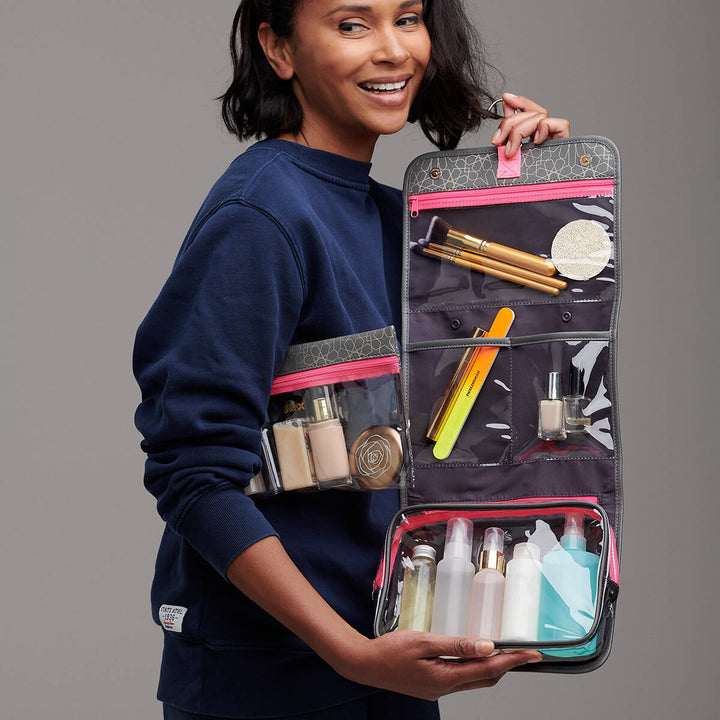 Woman holding hanging beauty bag