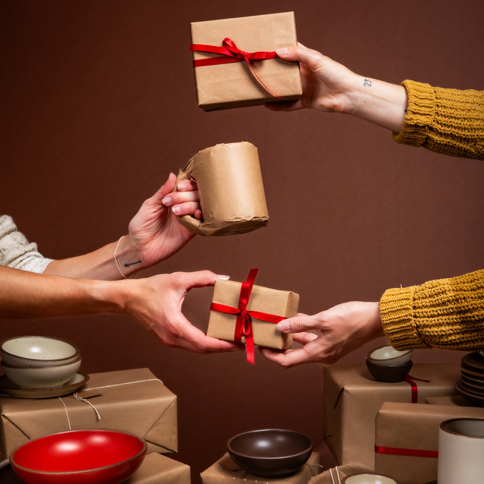 The exchange of gifts, wrapped in craft paper and tied off with the bow. One appears to be a mug.