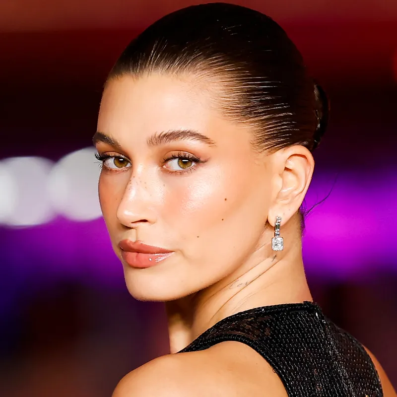 Hailey Bieber posing over her shoulder