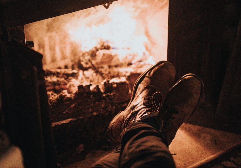 an image of a person sitting in front of a fire