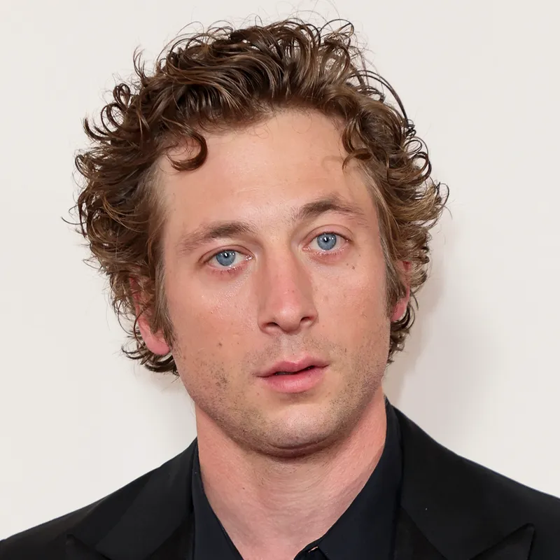 Jeremy Allen White attends an event in an all-black suit.