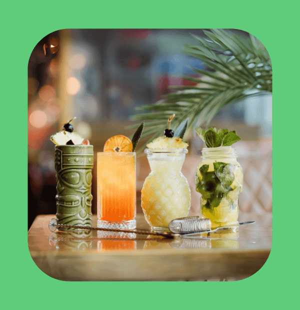 Lineup of tropical cocktails on a table at TGI Fridays