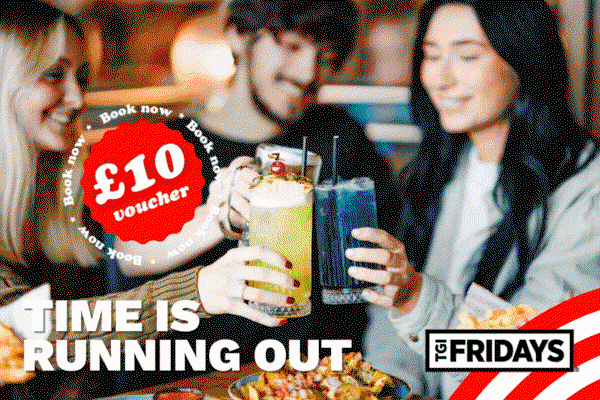 Group of friends celebrating and drinking cocktails at TGI Fridays