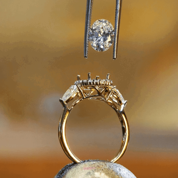 Diamond being fitted to gold ring