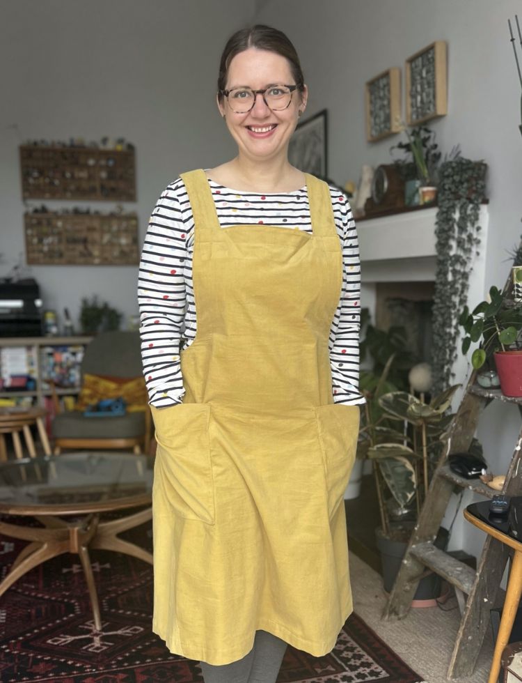 Apple Franca wearing The Assembly Line Apron Dress