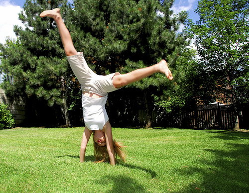 Doing cartwheels on grass