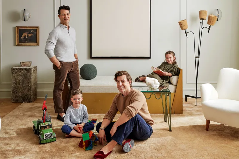 Image may contain: Human, Person, Nate Berkus, Living Room, Indoors, Room, Flooring, Screen, Electronics, Clothing, and Shoe