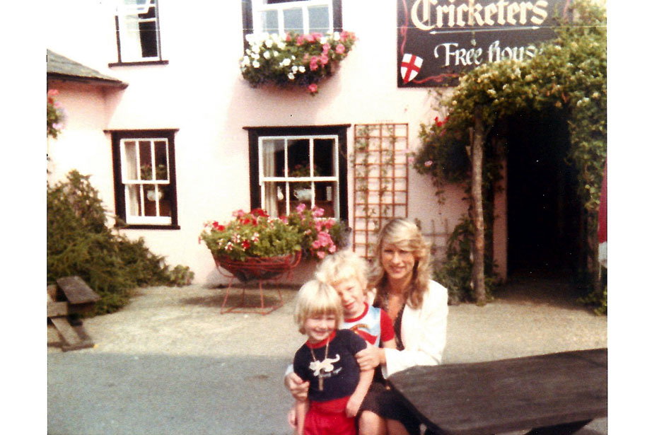 A young Jamie, his sibling and mother outside of his family pub, The Cricketers