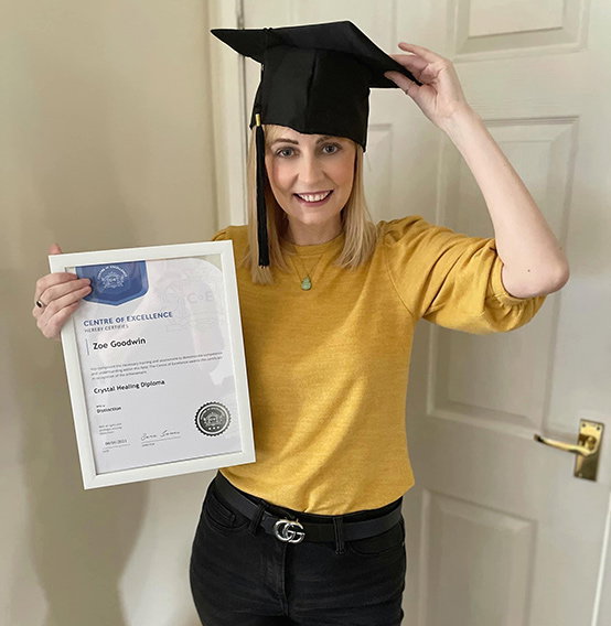 CoE student with a printed and framed CoE certificate