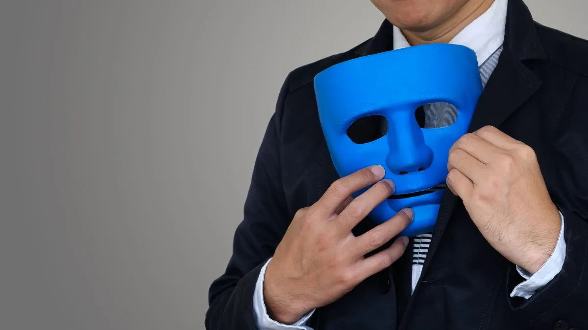 man_hiding_a_blue_mask