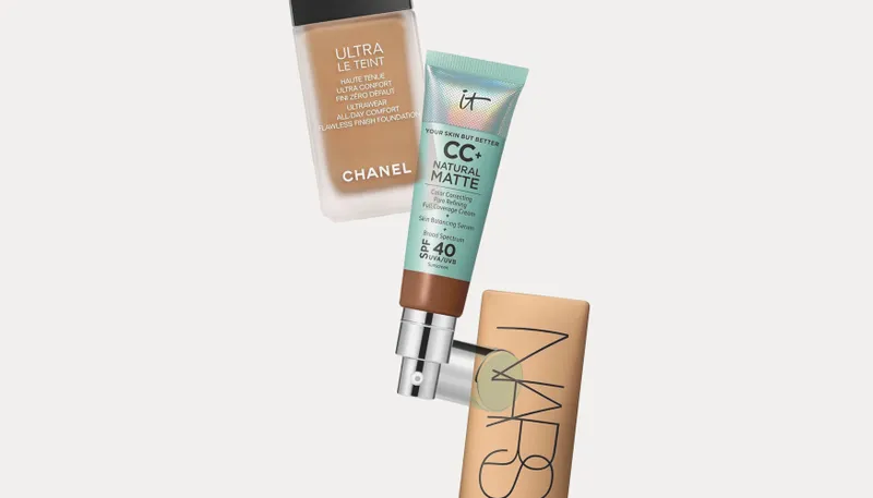 3 cosmetic products overlapping. From left to right: Frosted rectangular bottle with beige cream inside, squeezable tube with silver cap, and beige rectangular bottle.