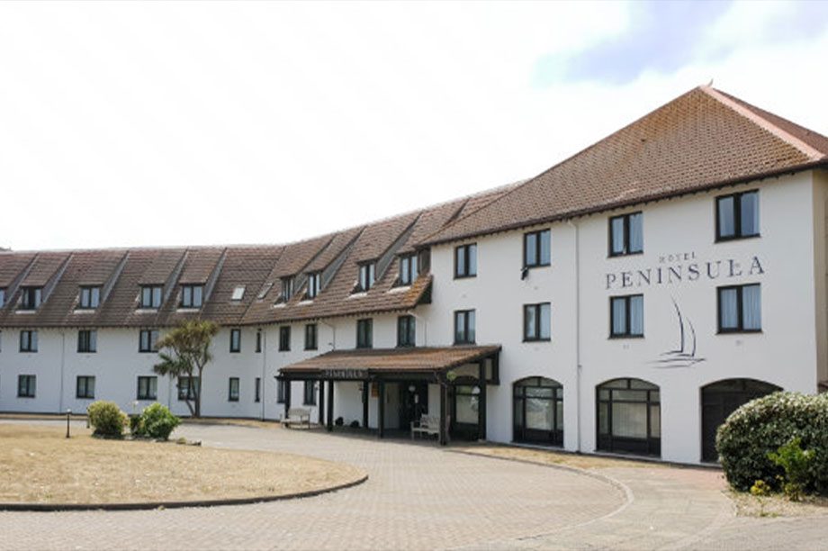 the front of the Peninsula Hotel on a summer day