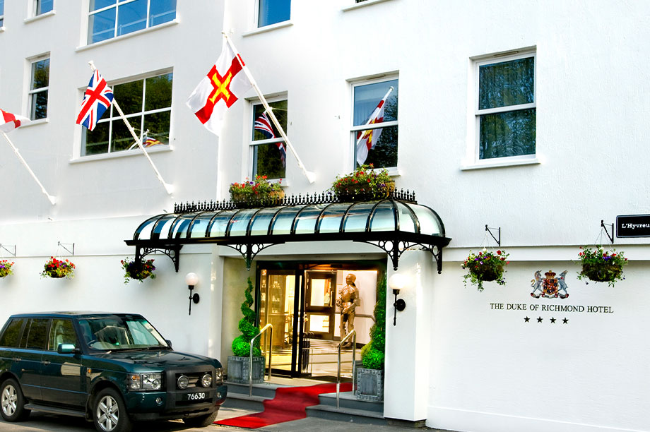 exterior of hotel and red carpet entrance