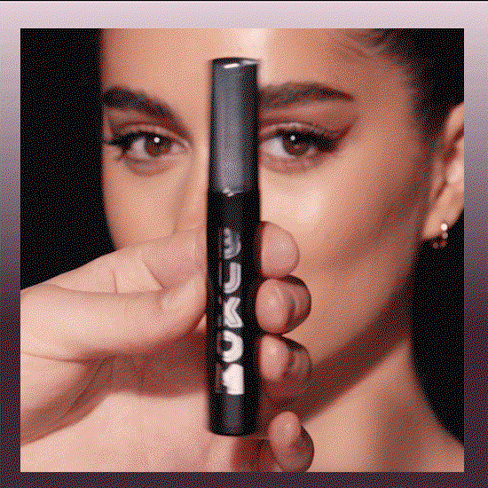 Closeup of eye applying mascara